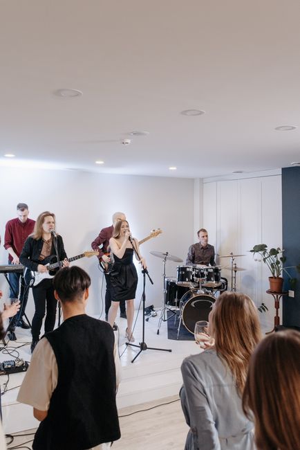 A band playing to a small room of people