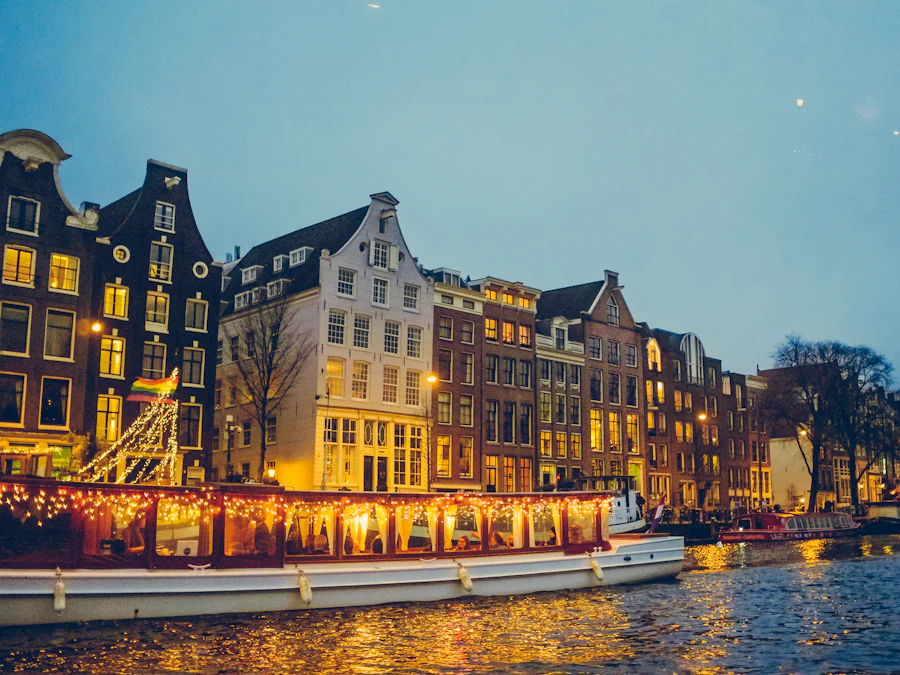Canal houses reflected in the water at blue hour