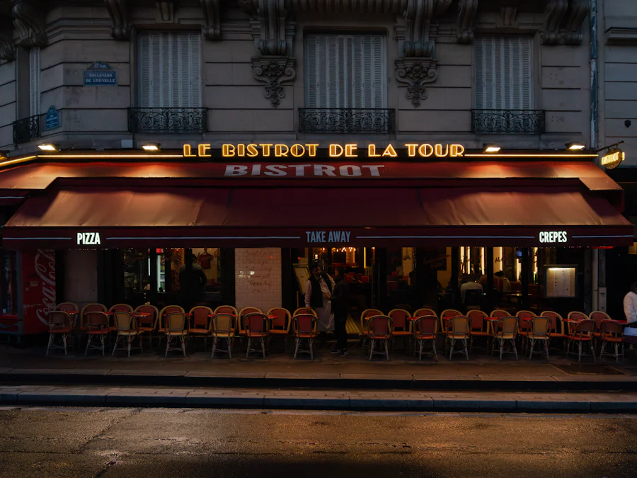 A Paris street at dusk with a lit shopfront