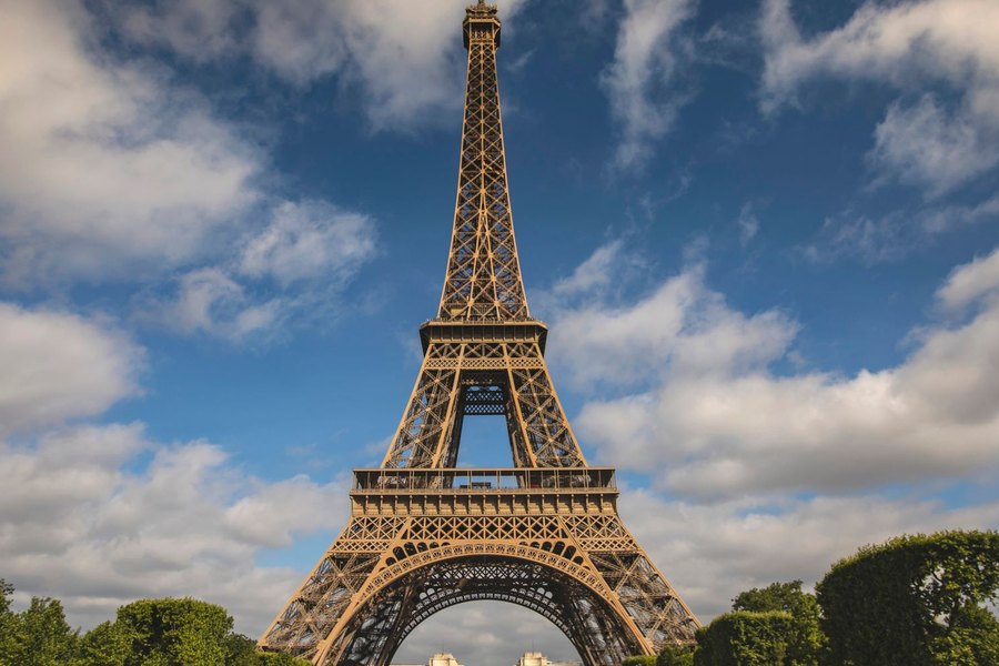The Eiffel Tower in Paris under a blue sky